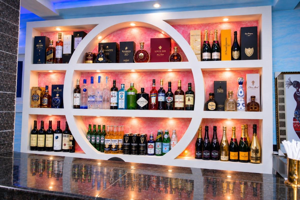 Luxury hotel bar stocked with premium spirits, champagne, wine and beverages at PEB Global Hotel